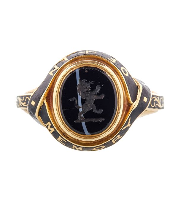 A Victorian 18ct gold, banded agate and black enamelled mourning ring, engraved with a lion crest in a black enamelled garter surround, detailed 'In M