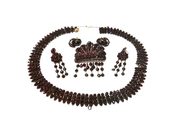 A collection of Bohemian garnet set jewellery, comprising; a pair of carbuncle garnet earstuds, a pair of pendant earrings, the tops with post and but