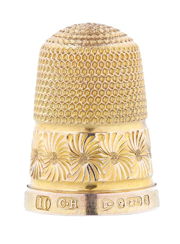 A 9ct gold thimble, decorated with a floral band by Charles Horner, Chester 1905, weight 3.7 gms, with the original case.  Illustrated