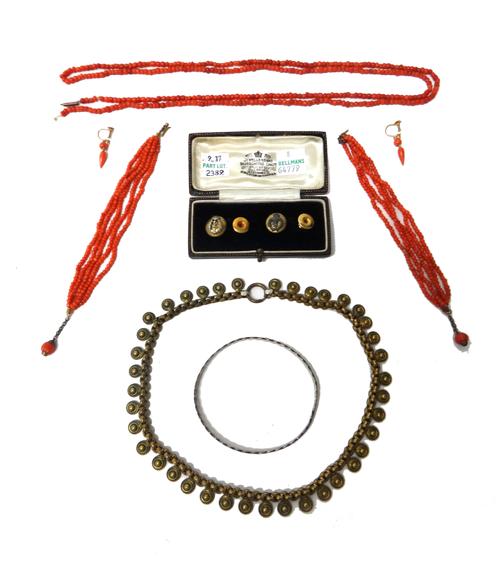 A group of coral jewellery, comprising; two bracelets, a necklace and a pair of earrings, having screw fittings with a Liberty case, a silver bangle,