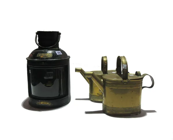Collectables, comprising; 'The Maritime', stern light, ebonised and two brass watering cans, (3). S5M