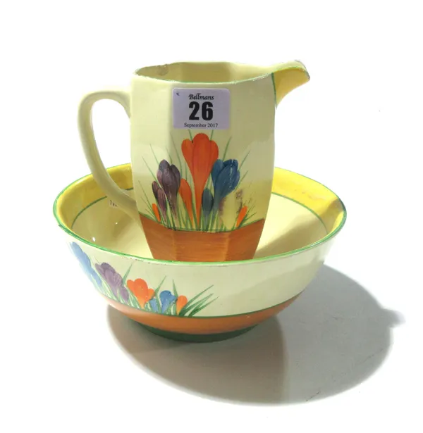 A Clarice Cliff Bizarre bowl, a similar jug and a pair of blue and gilt lidded vases, (4).   CAB