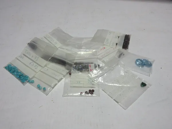 A quantity of unmounted gemstones and pastes, including, garnets, turquoise and two oval pale blue pastes. CAB