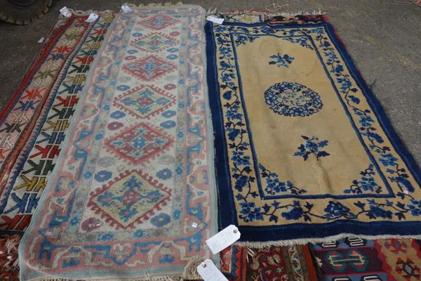 A Chinese rug, 176cm x 94cm and a Kashmir Caucasian style rug, 225cm x 69cm, (2). M8