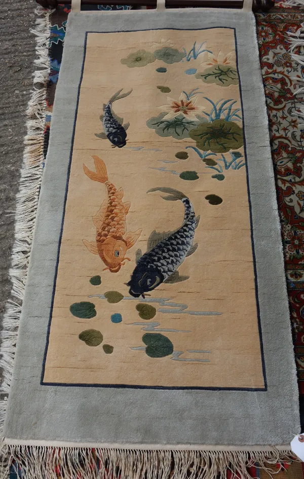 A silk Chinese rug, with fish, 126cm x 61cm. M12