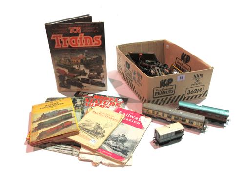 A quantity of early 20th century tin plate tracks and carriages, mainly OO gauge, (qty).   S10M