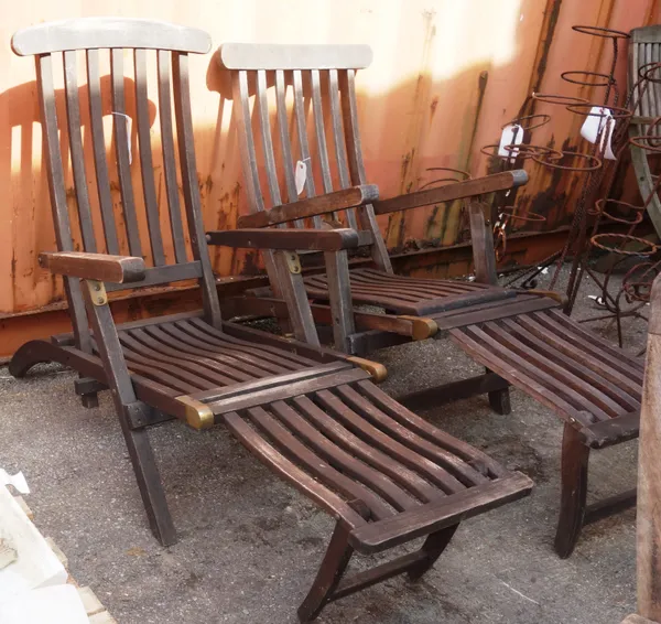A pair of 20th century teak steamer chairs. OUTSIDE