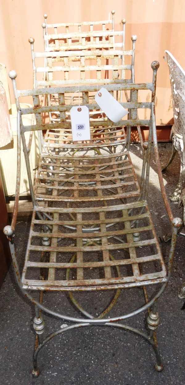 A set of four 20th century silver painted metal garden chairs. OUT