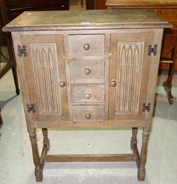 A late 19th century oak credence cupboard, with linen fold panels, 69cm wide x 92cm high. C8