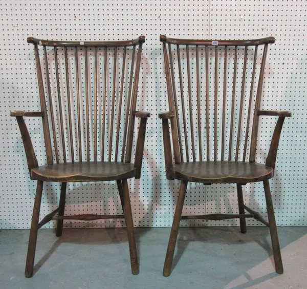 A pair of 20th century stained beech stick back armchairs, (2).   E3