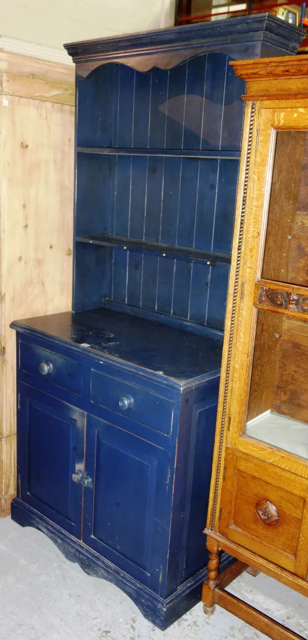 An early 20th century blue painted pine dresser, with two drawers and pair of panelled doors, 92cm wide x 200cm high.   M9