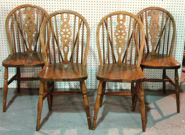A set of four  20th Century beech wheel back scullery chairs, (4).  G3