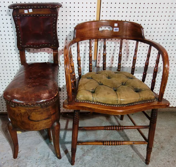 A 19th century oak bow back scullery chair and a cockfighting chair, (2).   F8