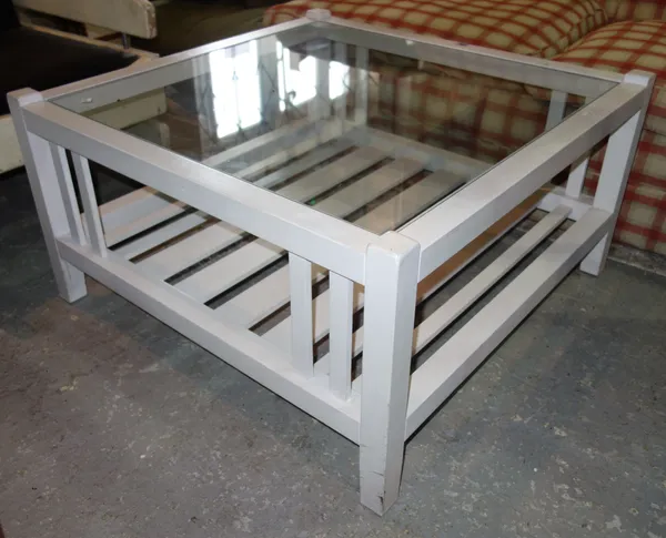 A 20th century white painted coffee table, 85cm wide.  C6