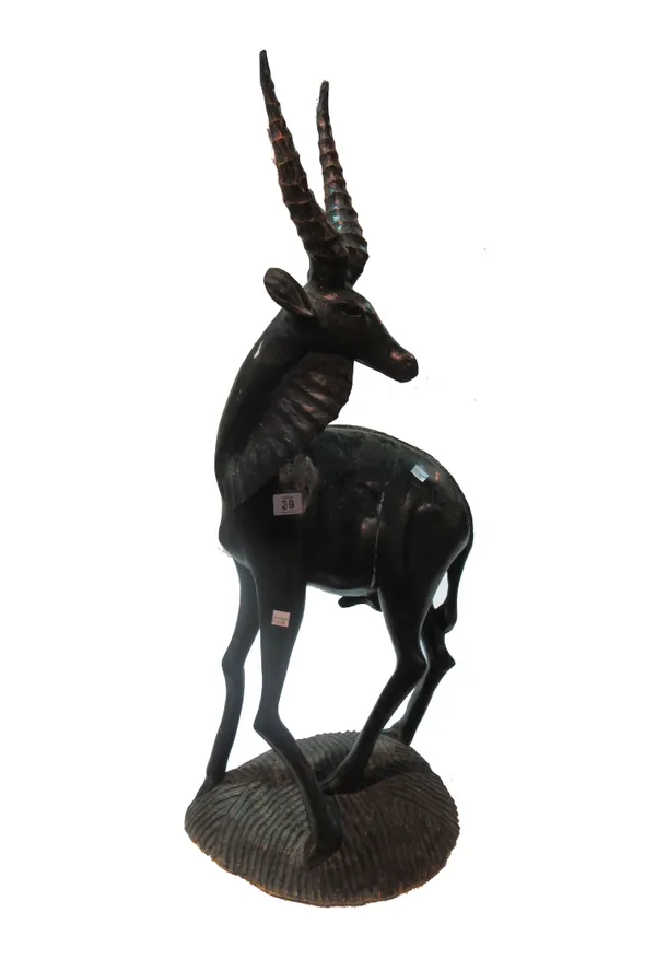 A large 20th century carved hardwood figure of an ibex, probably African.   SR