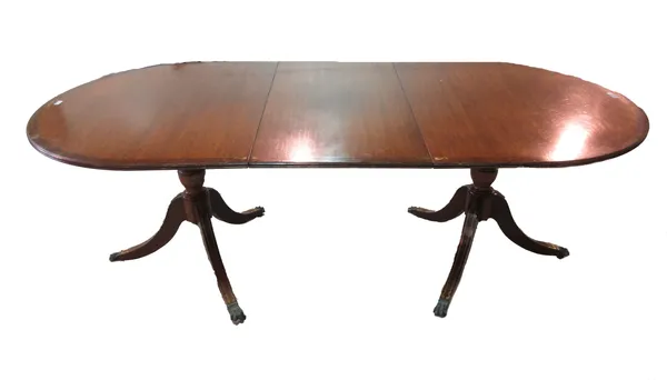 A Regency style brass inlaid mahogany 'D' end extending dining table, with one extra leaf, 101cm wide x 161cm long, 211cm long extended.  J8