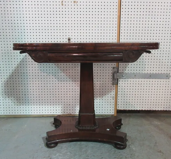 A late Regency mahogany 'D' shaped card table, with central column on bun feet, 91cm wide x 70cm high.  H8