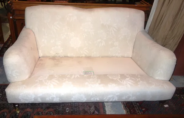 A 20th century mahogany framed white upholstered sofa, lacking seat cushions, 158cm long.  G6