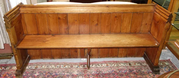 An early 20th century pine church pew, 183cm wide.  F6