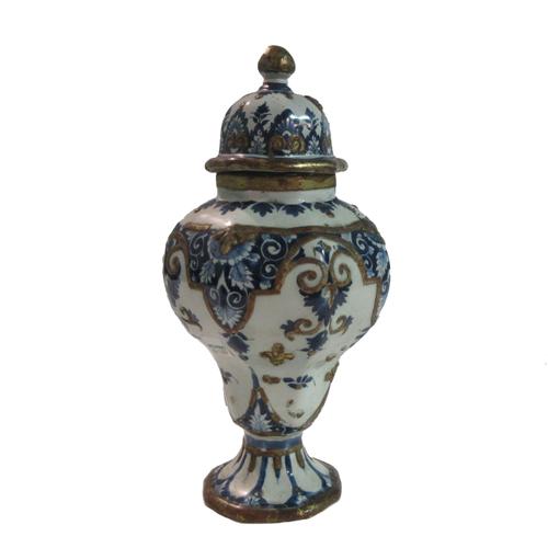 A Dutch Delft blue, white and gilt vase and cover, 18th century, decorated with applied gilt fleur-de-lys against an octagonal baluster ground (a.f),