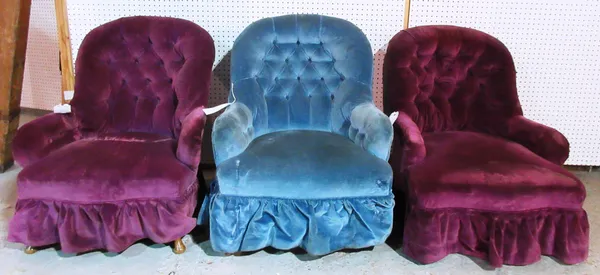 Two Victorian mahogany framed nursing chairs with purple upholstery, together with a similar armchair with blue upholstery, (3).    H3