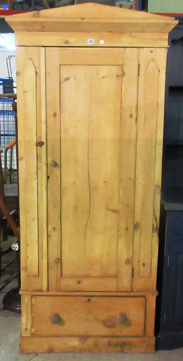 An early 20th century pine single wardrobe, with single drawer base, 98cm wide x 198cm high.  M9
