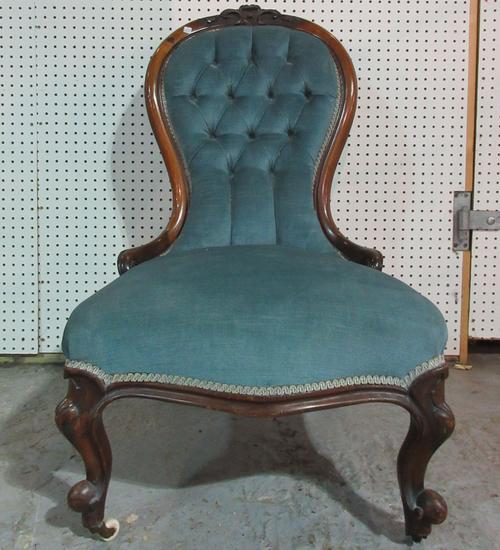 A 19th century mahogany spoon back nursing chair.   I5