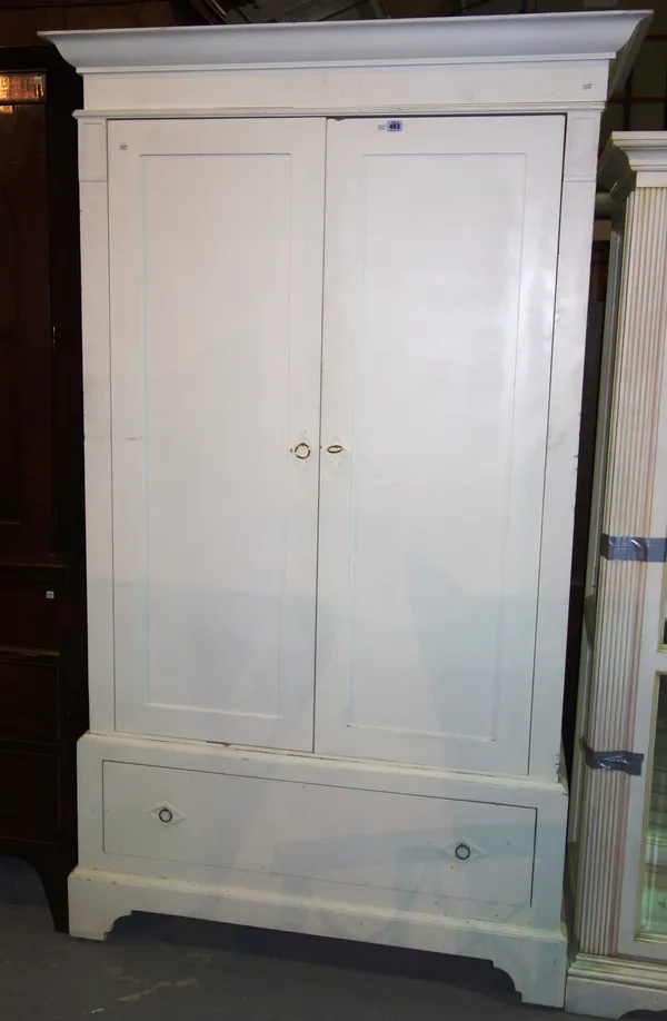 A 20th century white painted two door wardrobe, with single drawer base, 121cm wide x 205cm high. K8