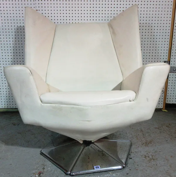 A 20th century white leather armchair, on an octagonal chrome base.   J8