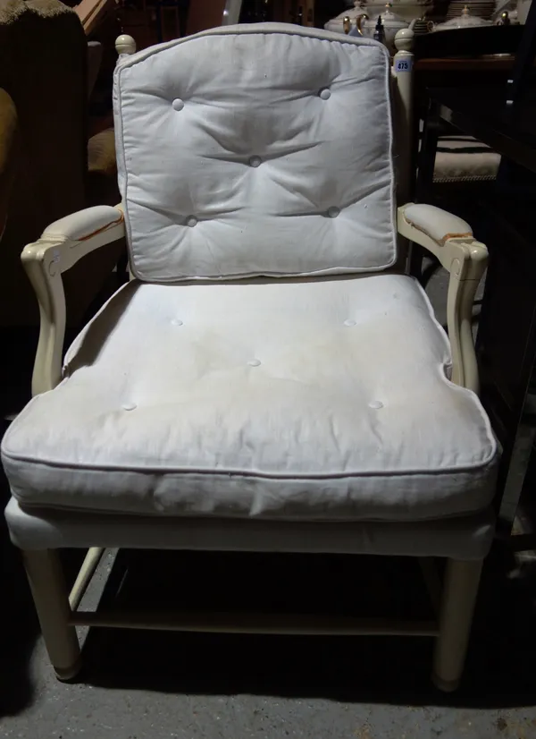 A 20th century white painted open armchair on turned supports, 69cm wide.   K5
