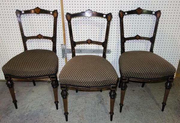 A set of three late 19th century ebonised side chairs, together with a chinoiserie decorated tripod table, (4).   K3