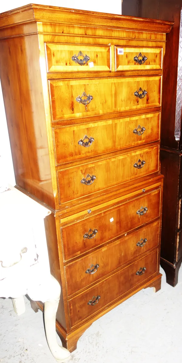 An 18th century style yew chest on chest, the two short and six long graduated drawers divided by brushing slide, 70cm wide x 155cm high.  L8