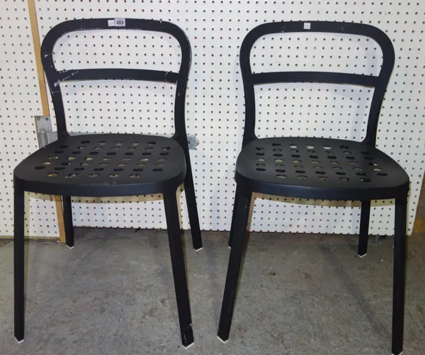 A set of four 20th century black painted metal stacking chairs, (4).  K4