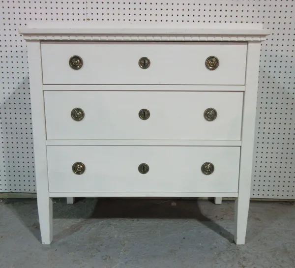 A 20th century white painted chest of three long drawers, on square supports, 85cm wide.   H9