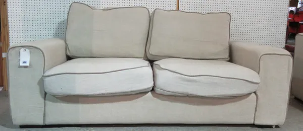 A 20th century cream upholstered square back sofa bed, 205cm wide, together with a matching armchair, 90cm wide, (2).  G5