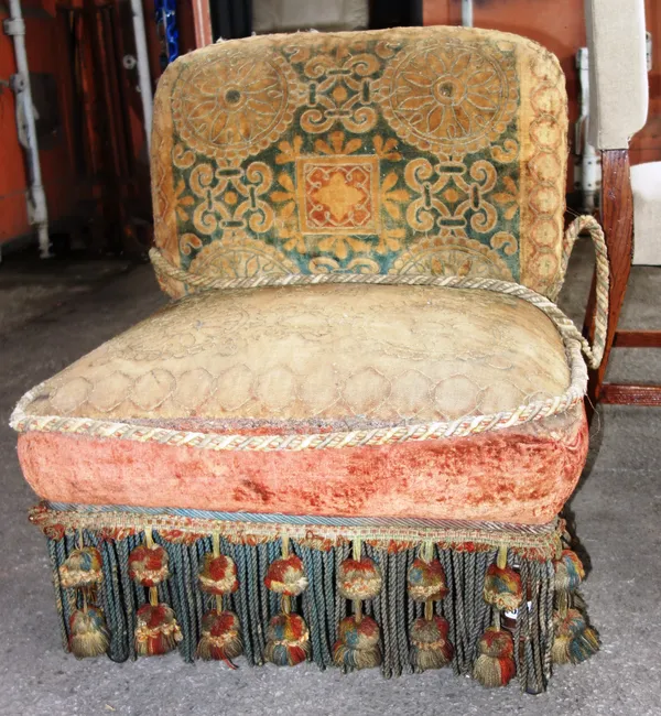 A Victorian low back easy chair, on turned mahogany supports.   K3