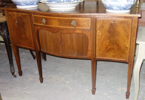 A 20th century mahogany inlaid sideboard, with brass gallery back tambour door on square tapering supports, 152cm wide.   D8