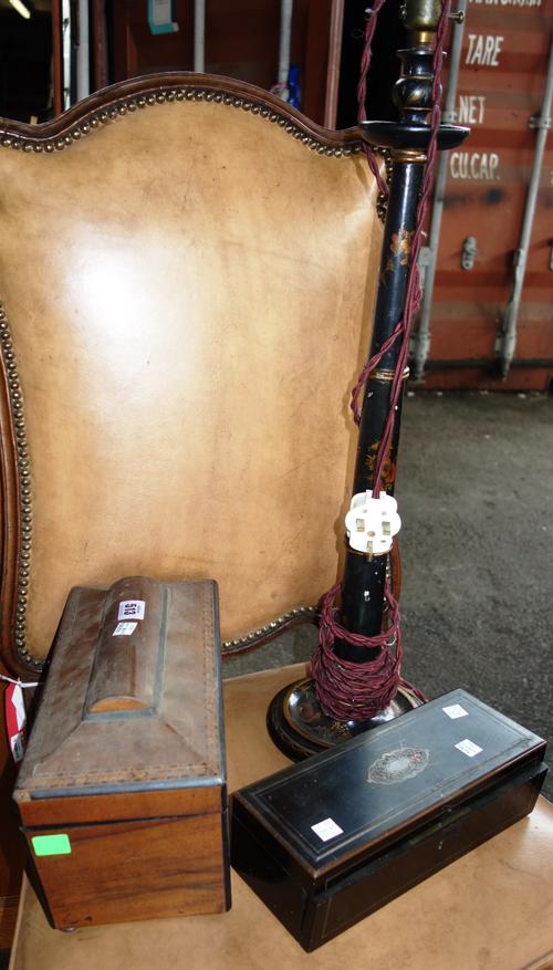A late William IV inlaid walnut sarcophagus tea caddy, 30cm wide, a Victorian ebonised glove box, 27cm wide and a black lacquer table lamp, (3).   CAB