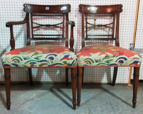 A set of three George IV mahogany dining chairs, with 'X' frame back and turned supports, to include one carver, (3).  L7