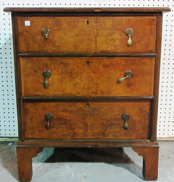A small 18th century style figured walnut chest of three long drawers, on bracket feet, 61cm wide. H6