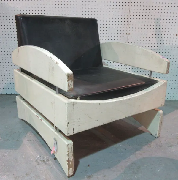 A 20th century white painted and black leatherette upholstered armchair, 68cm wide. B6