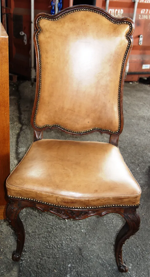 A Louis XV style walnut framed brown leather upholstered side chair.   L3