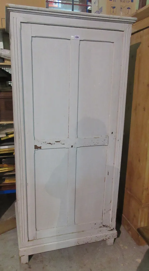 An early 20th century French painted single four panelled door wardrobe, on block feet, 84cm wide x 180cm high.   A9