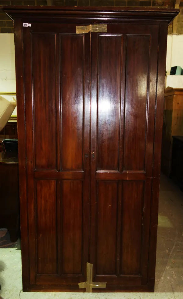 A late 19th century mahogany two door hall cupboard, 120cm wide x 214cm high.   K7