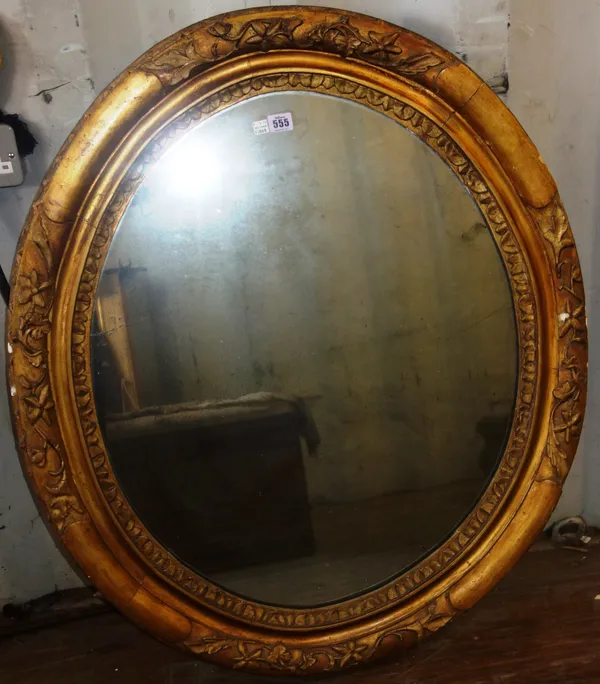 A 19th century gilt framed oval wall mirror, with moulded frame, 93cm high.  A2