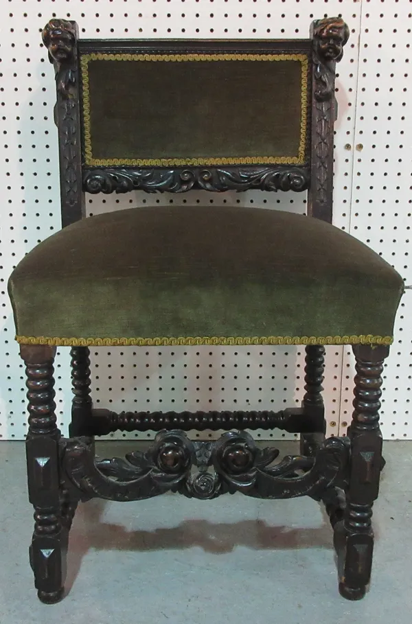 A 17th century style carved oak side chair, with cherub carved uprights.  F5