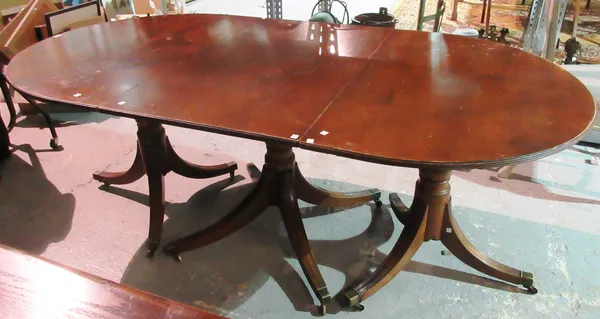 A Regency style mahogany triple pedestal extending dining table, with two extra leaves, 201cm long, 278cm fully extended.  K3
