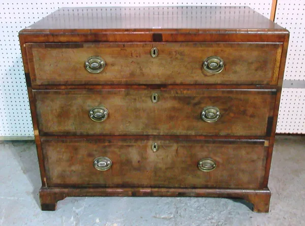A mid-18th century walnut chest of three long drawers with feather banded decoration, 101cm wide x 85cm high. M6