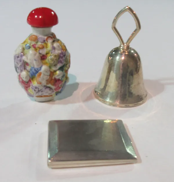 A Chinese snuff bottle, a European silver bell and a silver bookmark case, (3).  CAB