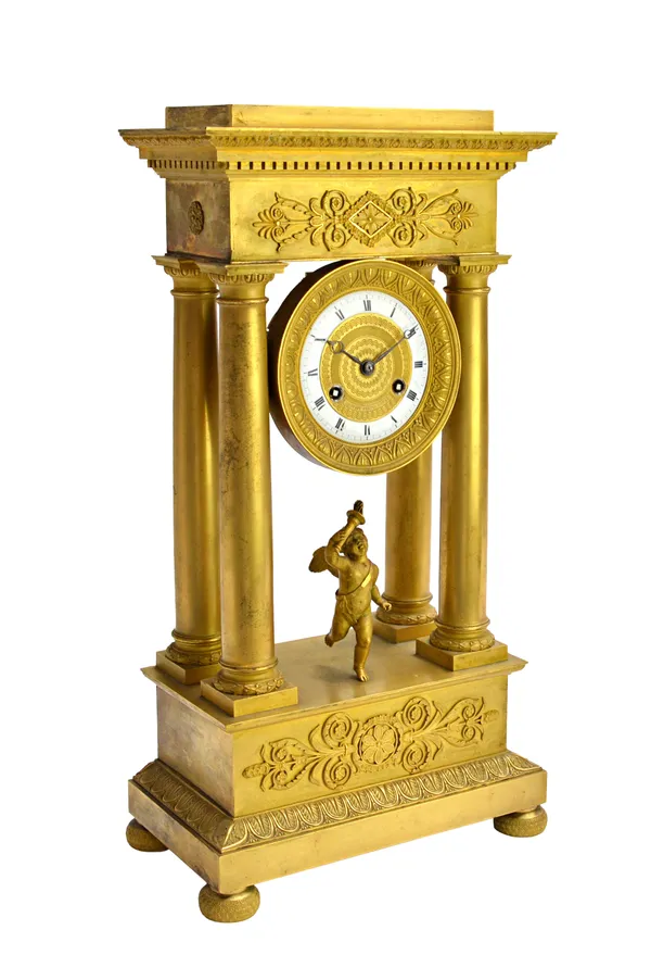 A Louis Philippe ormolu striking portico mantel clock, Destape, Paris, mid-19th century, with enamel and engine turned dial flanked by Corinthian colu